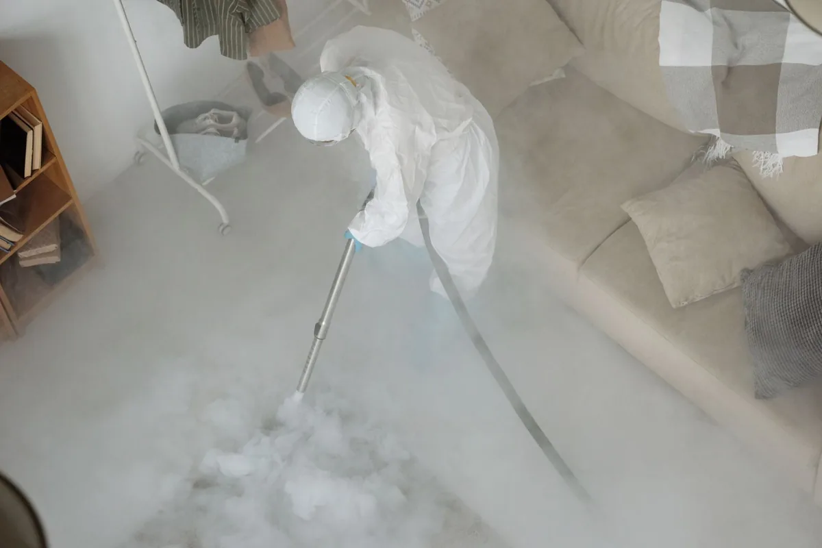 Biohazard cleanup technician in protective equipment, Washington, MO